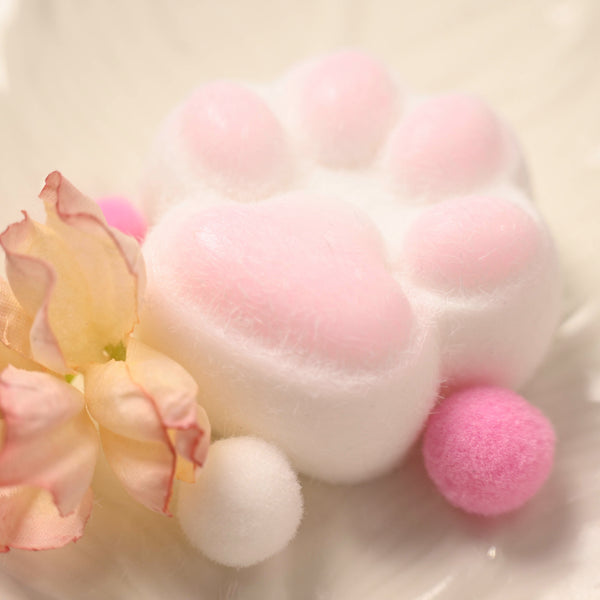 Pink and white kitten paw